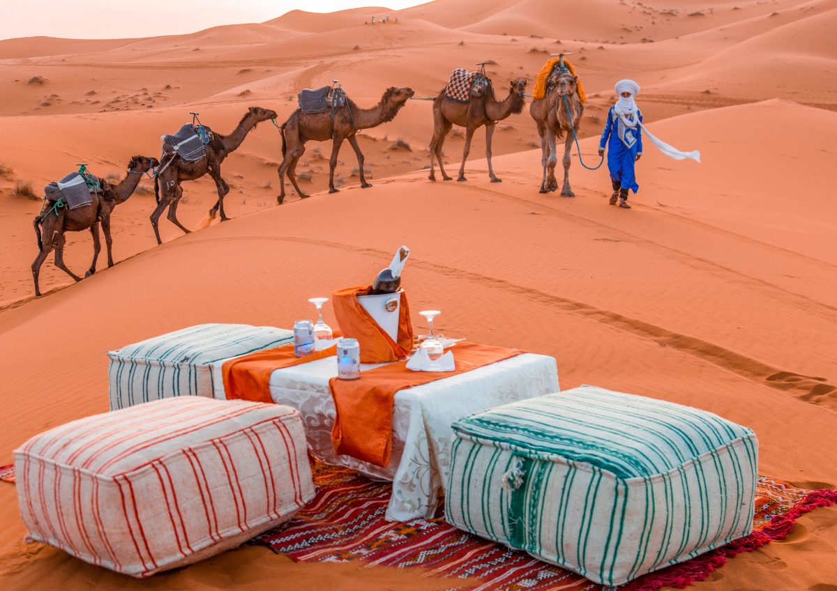 Merzouga stargazing experience tour by campfire beneath the stars across Morocco's Sahara Desert dunes.